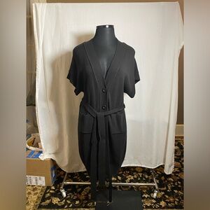 Black sweater overpiece with sash belt, size large.